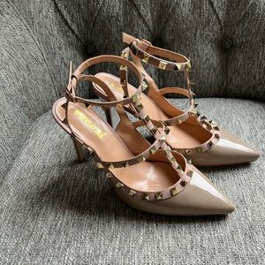 - Woman’s vegan leather gold studded heels. Size 8.5